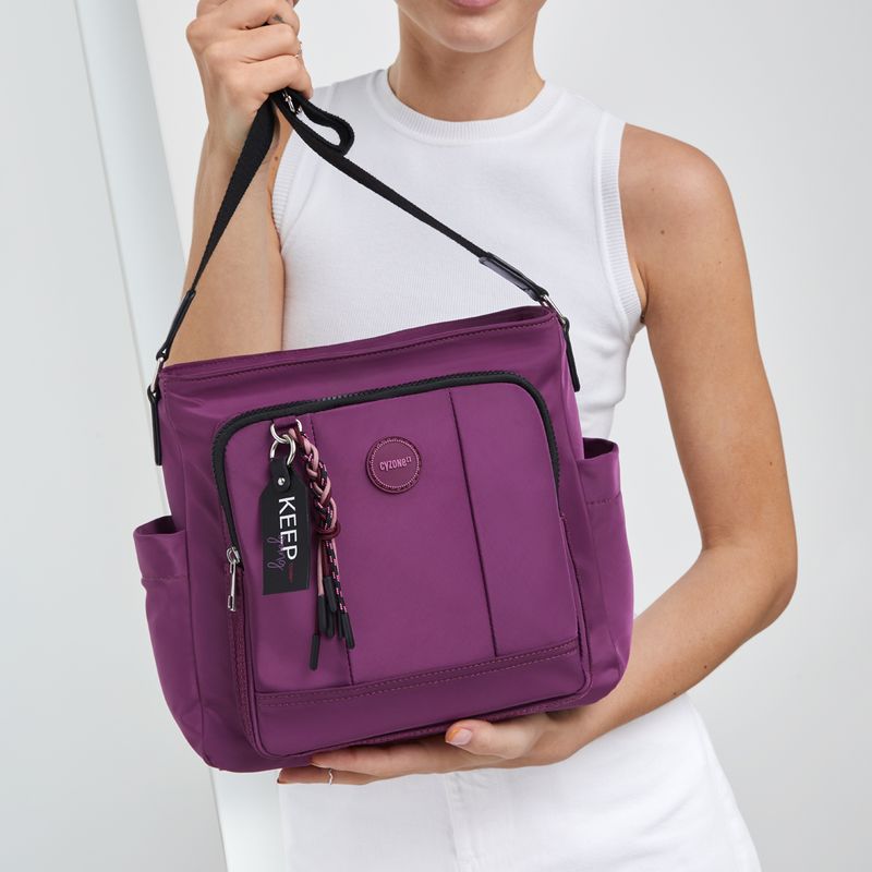 Morral-para-mujer-de-estilo-casual-de-color-morado-en-tela-poliester-con-asa-larga-regulable.